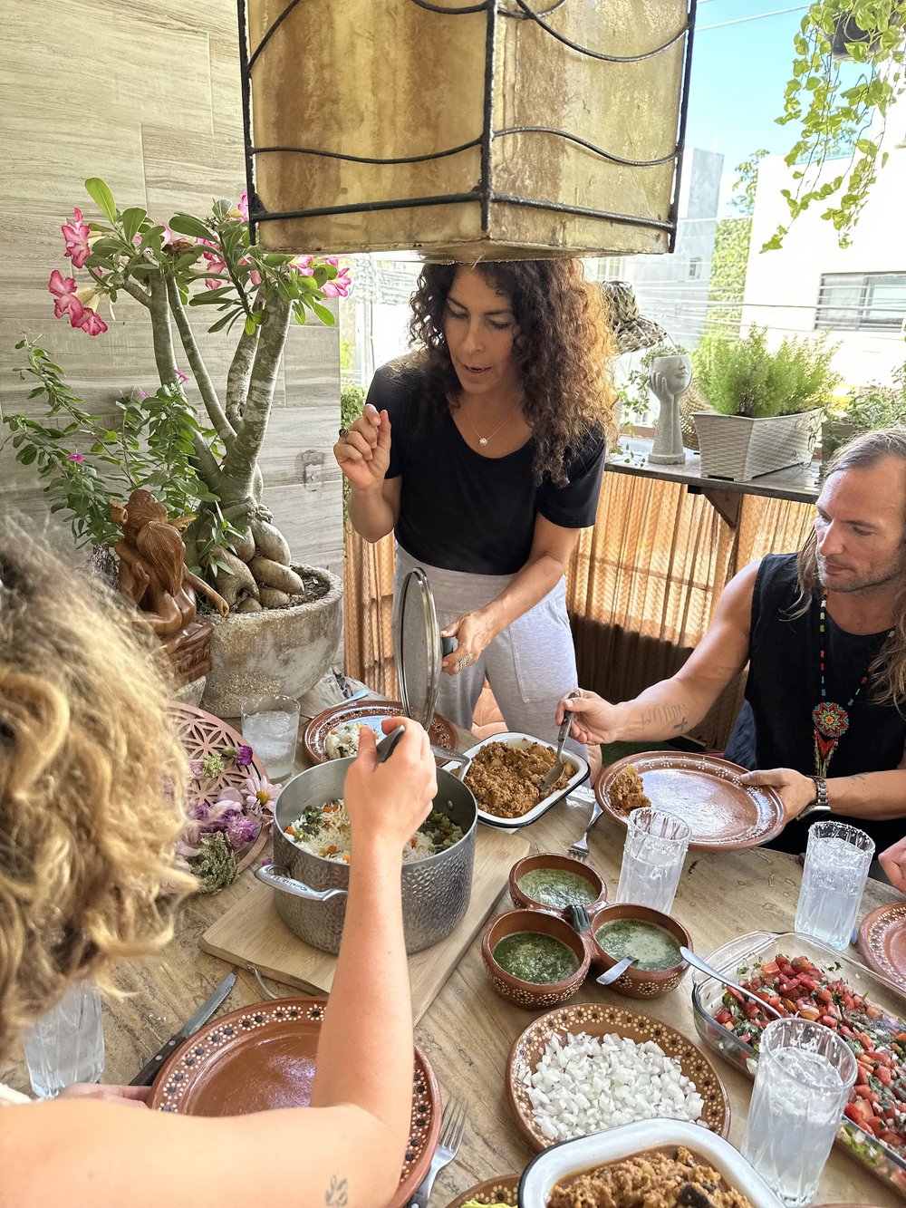 People sharing a meal from Itzel Yoga’s gallery