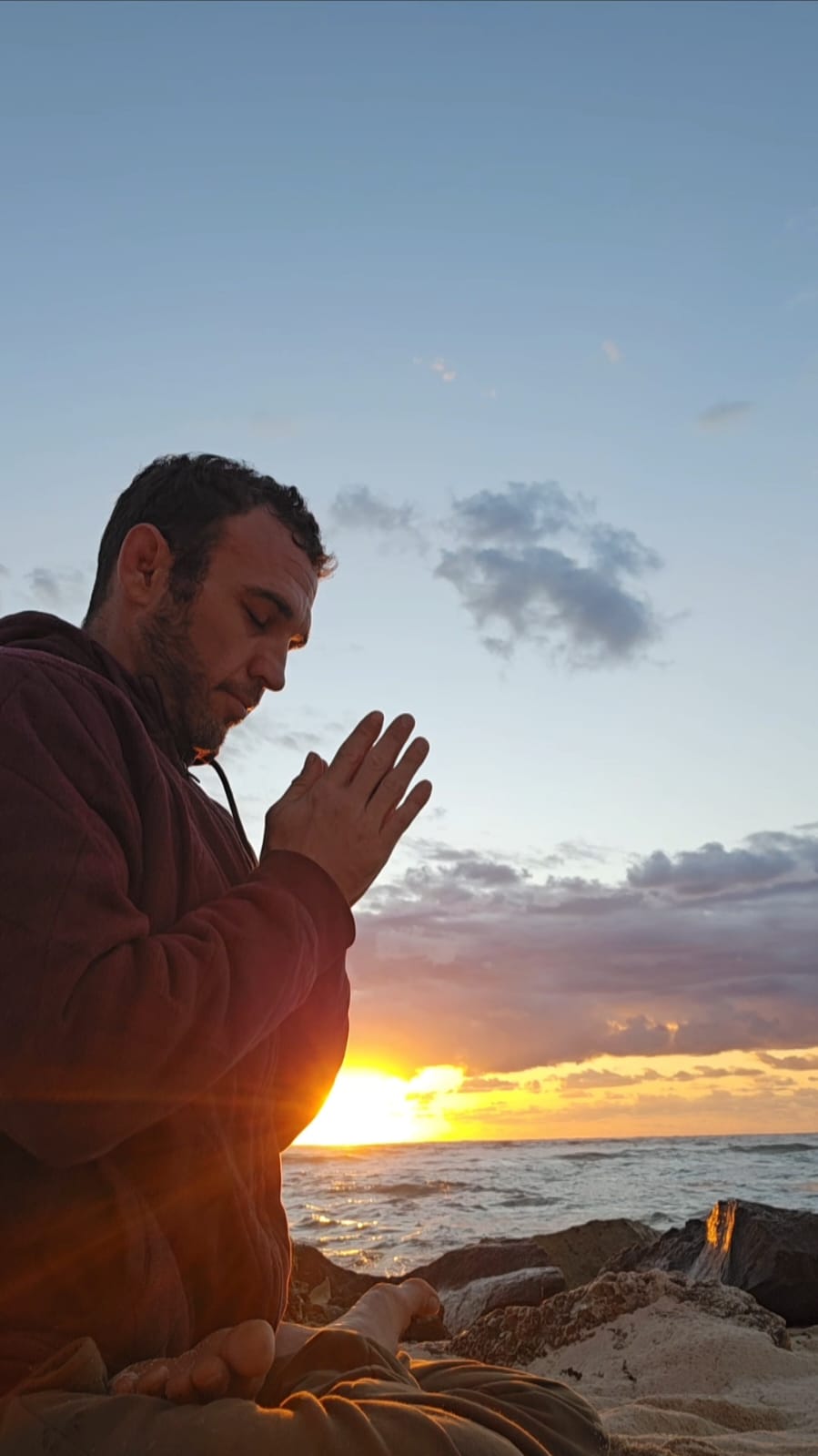Jayson Barniske by the ocean at sunrise